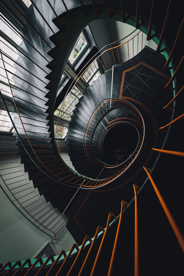 Stunning spiral staircase captured in a high-angle architectural shot in Dresden, Germany.
